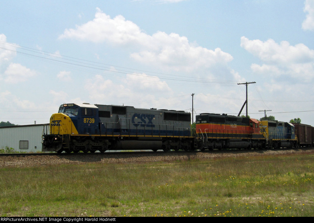 CSX 8739 leads a train towards the yard